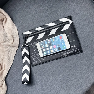 Fashionable clapperboard cross-body bag with monochrome print and textured wrist strap