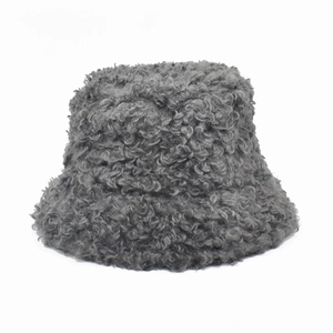 Close-up of thick grey faux lamb wool texture on a warm winter bucket hat for women