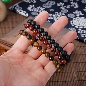 Tiger eye stone beaded bracelet set for men with a stainless steel skull accent