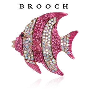 Macro detail of high-end fish brooch with sparkling pink and AB crystal rhinestones