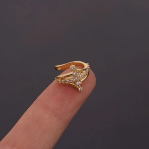 Detail of gold U-shaped ear cuff with sparkling zircon crystals in a double-layer design