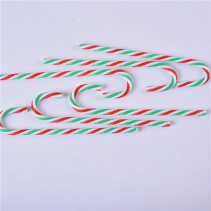Set of 6 red white and green striped acrylic Christmas candy cane ornaments on white background