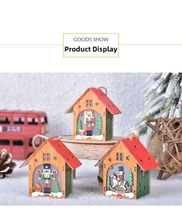 Close-up of three wooden Christmas house ornaments with nutcracker soldier designs