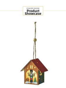Detail of a glowing wooden Christmas house ornament with nutcracker and hemp rope