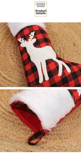 Close-up of red and black buffalo plaid Christmas stocking with reindeer plush embroidery