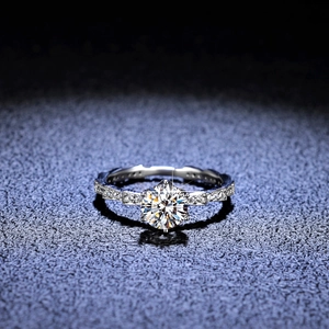 Luxurious 925 silver moissanite ring with a large round center stone and pavé diamonds