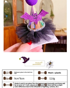 Detail of Halloween glowing purple bat hair clip with mesh dress showing 9x8cm dimensions