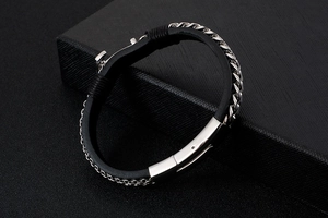 Close-up of black leather braided bracelet with silver stainless steel chain detail