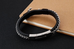 Detail of black silicone bracelet with silver stainless steel chain and metal clasp