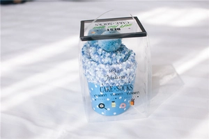 Plush coral fleece mid-calf cake socks packaged in a premium transparent gift box