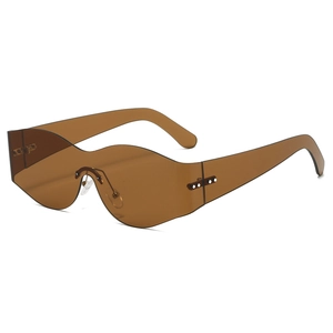 Y2K rimless sunglasses with wavy amber lenses and curved wrap design for women