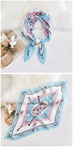 Detail of pleated silk scarf with vintage paisley print and elegant chain patterns