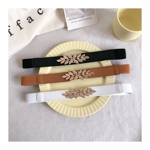 Three-piece skinny elastic belts for women with gold leaf buckles in black, brown, and white