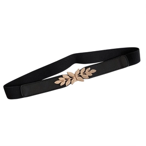 Women's black elastic waist belt featuring a decorative golden metal leaf buckle