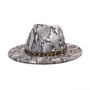 Detail of snakeskin fedora hat with leopard print band and golden metal buckle