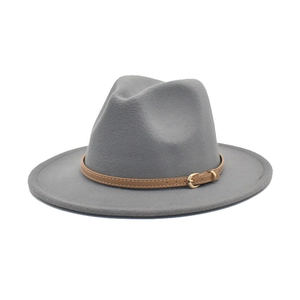 Detail of grey wool fedora hat featuring a brown leather belt with golden metal buckle