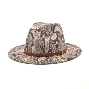 Detail of snake skin print wool fedora hat with brown faux leather belt and gold buckle