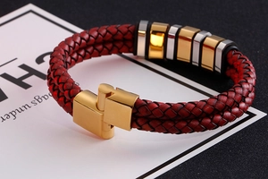 Macro detail of red double-layered braided leather bracelet with gold and silver metal beads