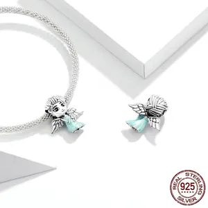 925 sterling silver snowflake fairy charm with blue enamel on a silver mesh bracelet