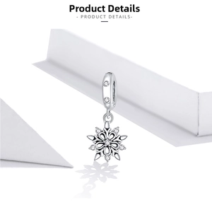 Detailed view of S925 sterling silver snowflake charm with sparkling cubic zirconia