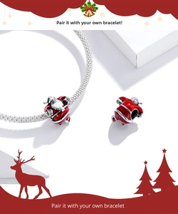 Detailed macro view of S925 sterling silver Santa Claus charm with red enamel finish