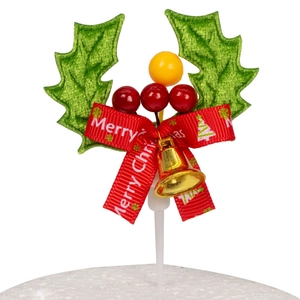 Christmas cake topper with holly leaves berries red bow and gold bell on white background