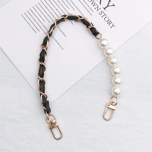 DIY phone case and bag strap with golden chain, black leather, and large white pearls