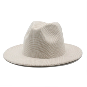 Detail of light beige plaid fedora hat showing classic checkered wool texture and wide brim