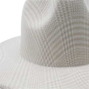 Close-up of houndstooth wool fabric texture and stitching on British style jazz hat