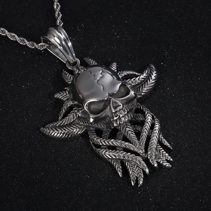 Gothic punk skull pendant in polished stainless steel with feather details on rope chain