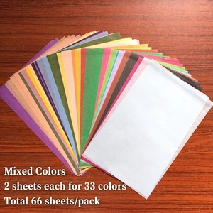 Detailed flat lay of 66 sheets of A5 tissue paper in 33 vibrant colors for DIY packaging