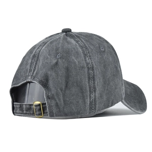 Detail of vintage washed cotton baseball cap with adjustable antique bronze metal buckle