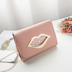 Chic pink crossbody chain bag with a gold lip and star metal clasp on a textured flap