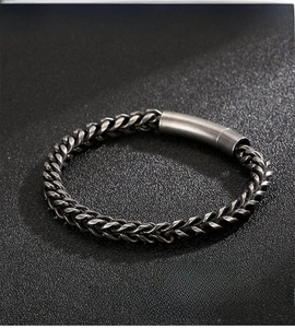 Macro detail of industrial style 316L stainless steel bracelet with cylinder clasp