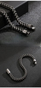 Detail of vintage wheat chain bracelet with cylindrical magnetic clasp on leather