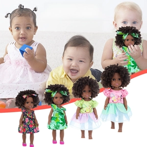 Four 35cm Afro black skin vinyl dolls wearing colorful floral dresses with matching headbands