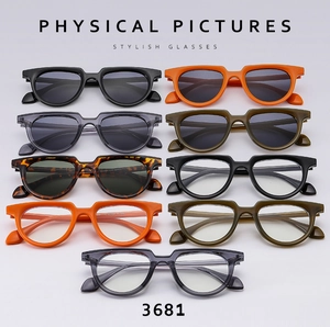 Collection of retro small-frame sunglasses and eyeglasses in various vibrant colors