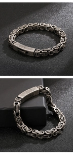 Detail of vintage Byzantine style silver steel chain bracelet for men with metal clasp