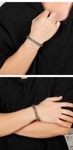 Close-up of vintage Byzantine chain bracelet in retro silver stainless steel for men