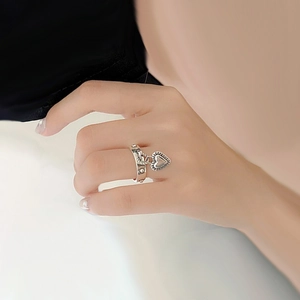 Minimalist silver open ring featuring a dangling hollow heart pendant for women