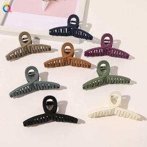 Detailed view of large matte hair claws in a variety of trendy colors for thick hair