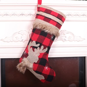 Red and black buffalo plaid Christmas stocking with elk applique and plush fur trim