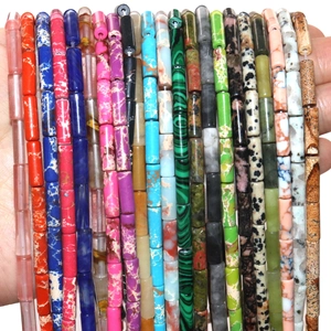 Makroaufnahme bunter Katzenaugenstein-Perlen für DIY-Schmuck in vielen kräftigen Farben