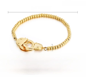 Detailed specs of the stainless steel bead bracelet featuring a gold handcuff charm pendant
