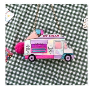 Detail of laser faux leather ice cream truck bag with fluffy pompom and chain strap