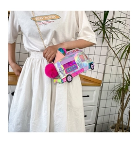 Detail of laser holographic ice cream truck crossbody bag with pink pompom and gold chain