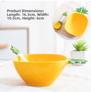 Pineapple-shaped ceramic salad bowl with grid texture and green leaf spoon details