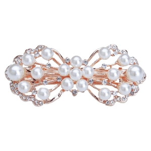 Elegant rose gold bow hair clip with white pearls and rhinestones on a clean white backdrop