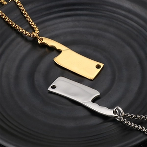 Detail of creative stainless steel mini cleaver pendants in gold and silver finish