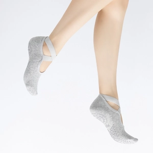 Gray non-slip yoga socks with ballet crisscross straps and ergonomic silicone grips